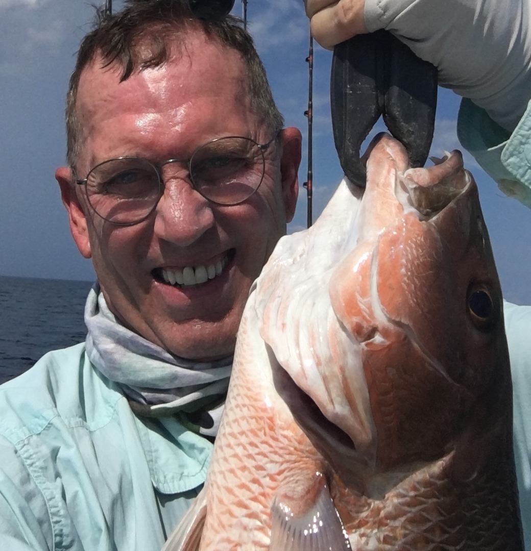 An angler with a large catch close to the camera